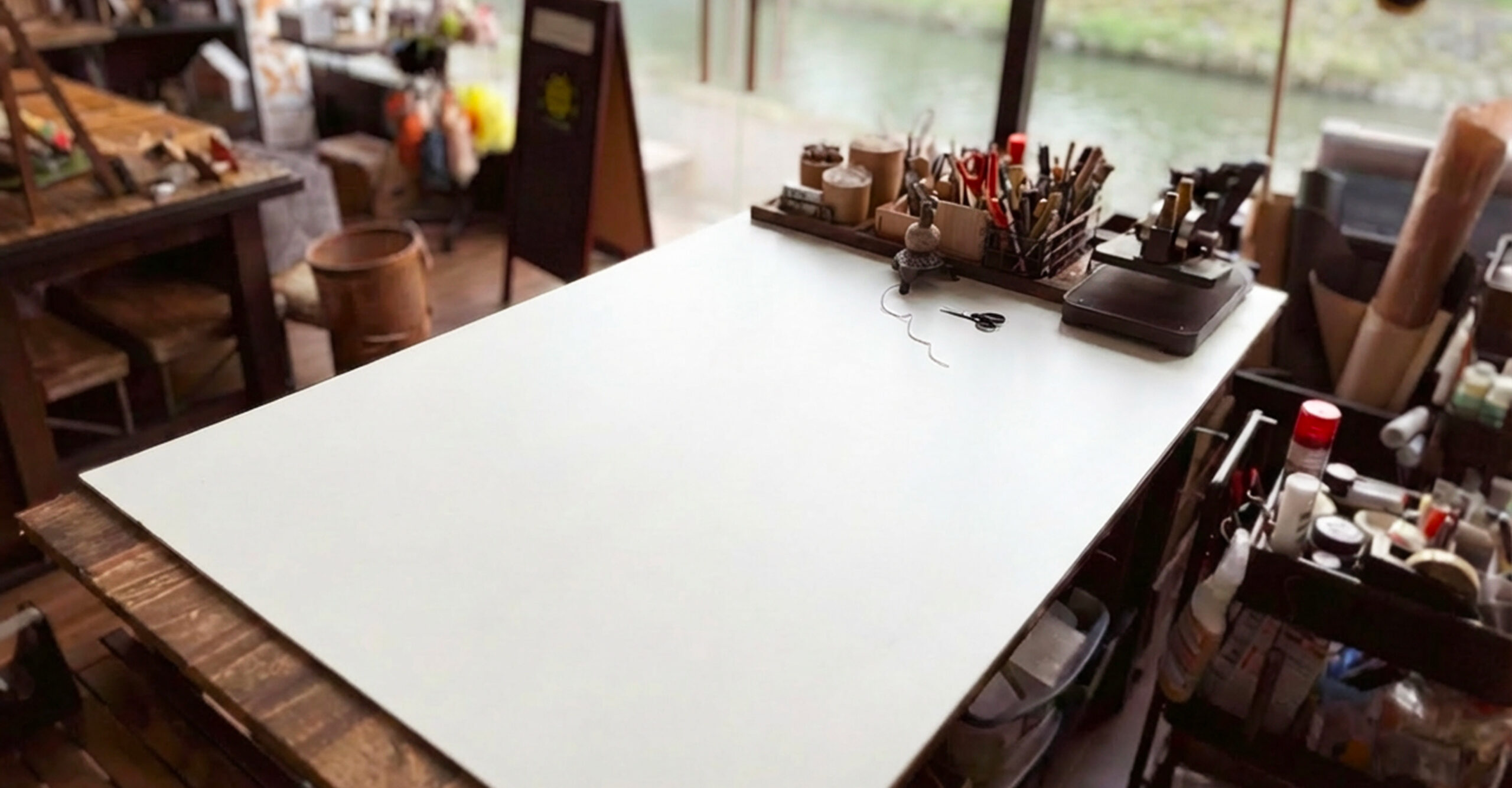 A quiet worktable in the Kyoto atelier, waiting before the first touch.