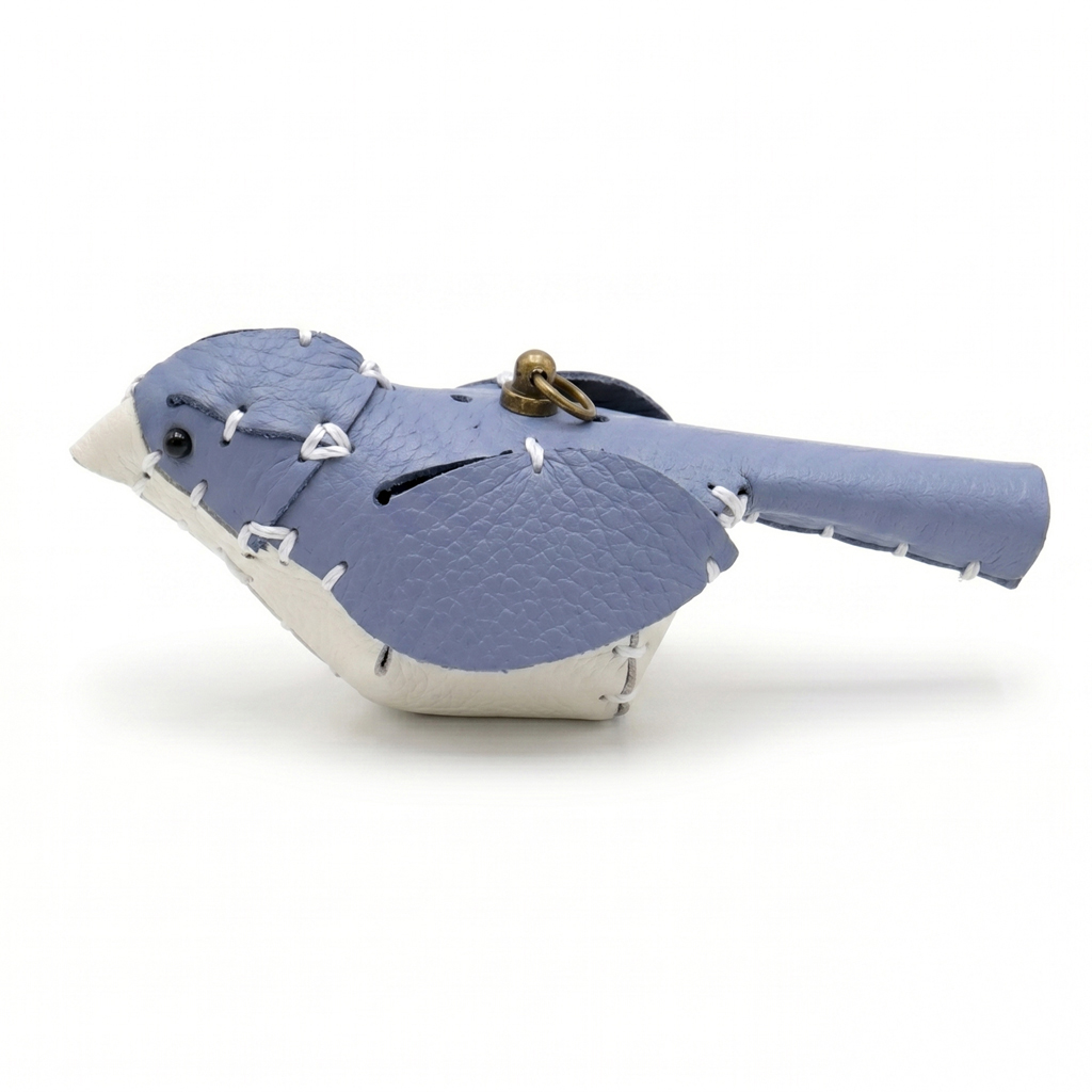 The Blue and White colourway — a leather bird with a blue back and white breast.