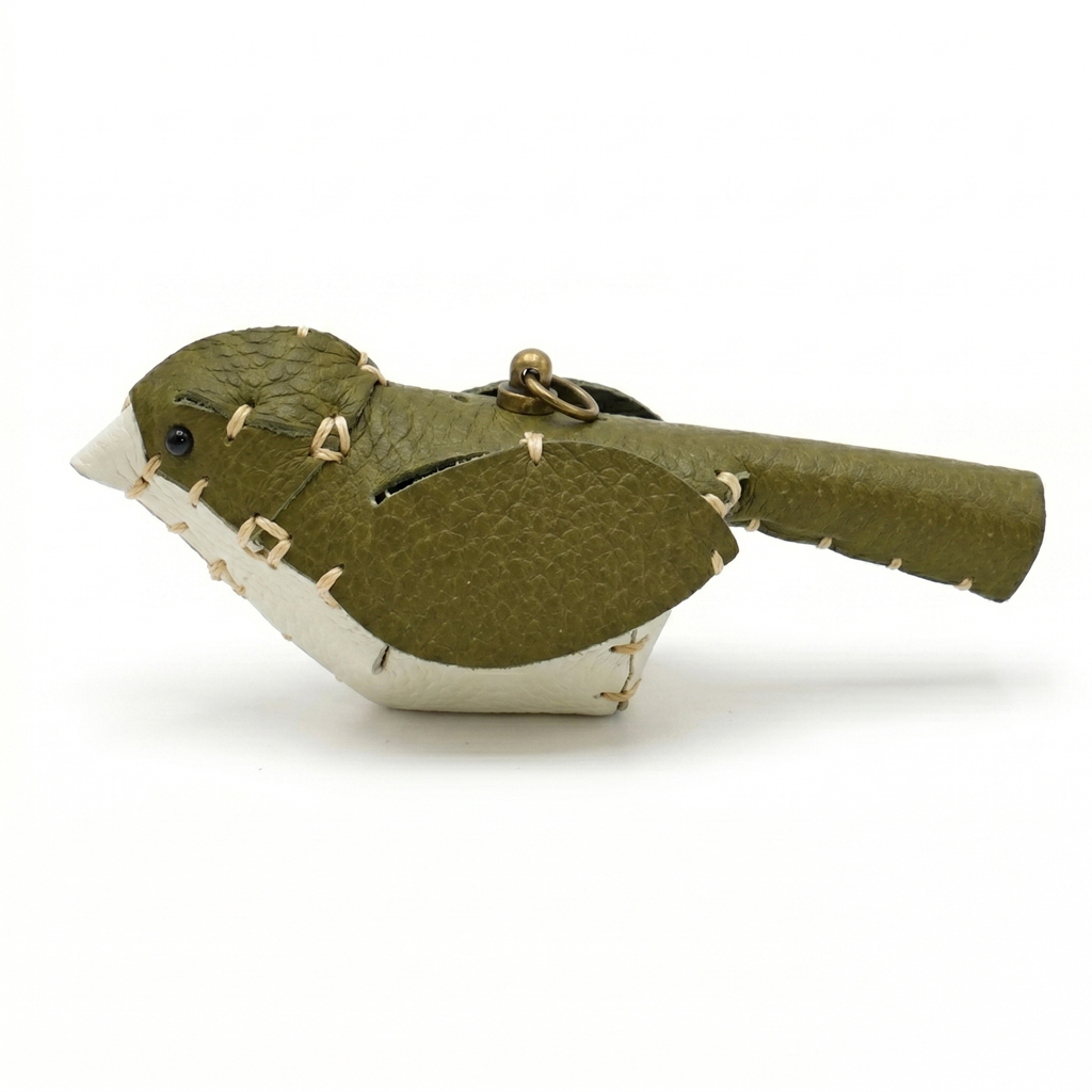 The Khaki and White colourway — a leather bird with a khaki back and white breast.