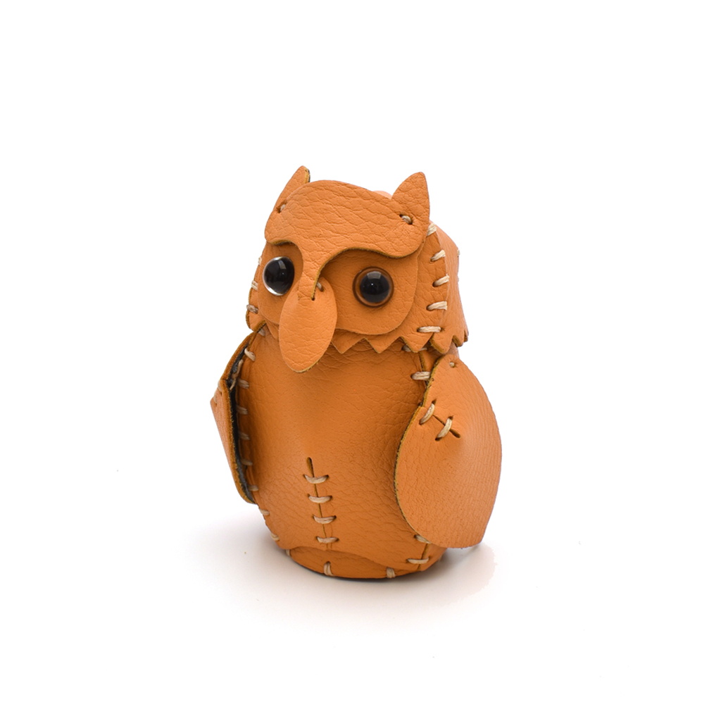 The Orange colourway — a single hand-stitched horned owlet, front view.