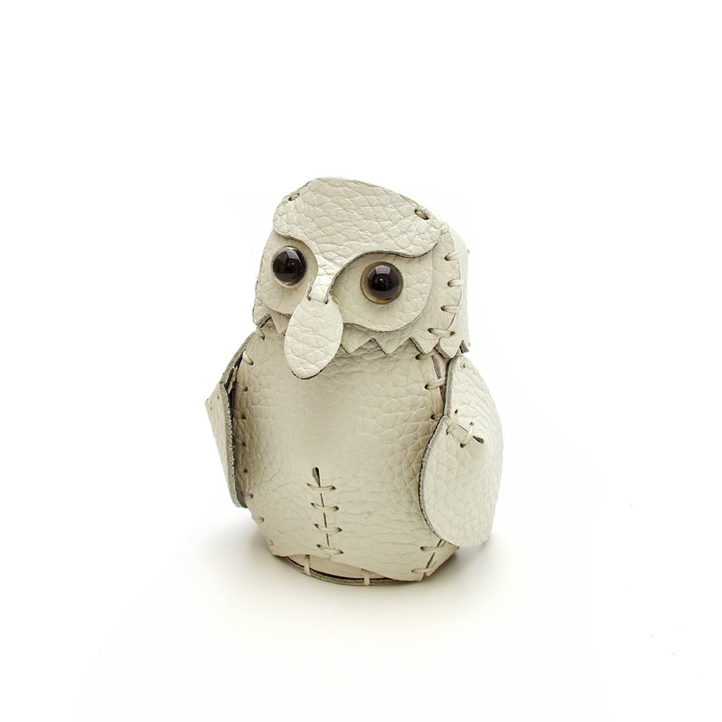 The White colourway — a single hand-stitched leather owlet, front view.