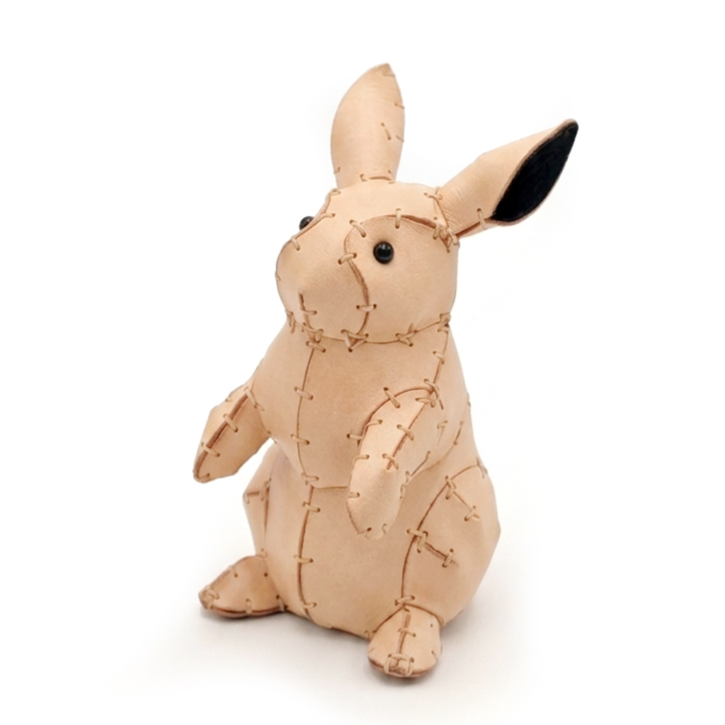 The Natural colourway — a single standing leather rabbit in veg-tanned leather.