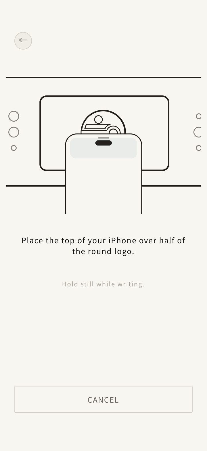 Holding the phone to the patch to write it